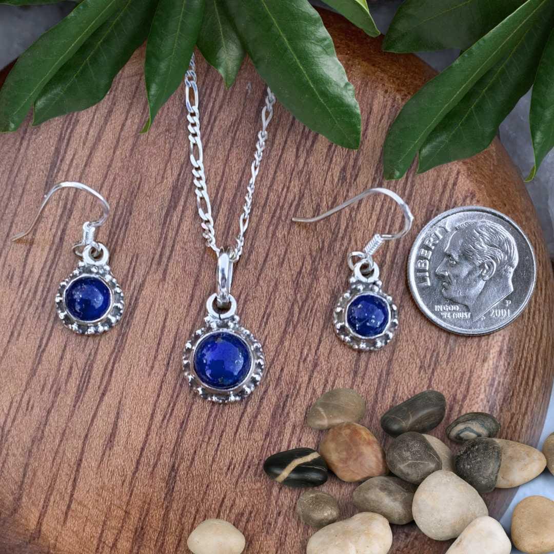 an image of a Dainty Sterling Silver Lapis Lazuli Pendant and Earrings Set next to a dime