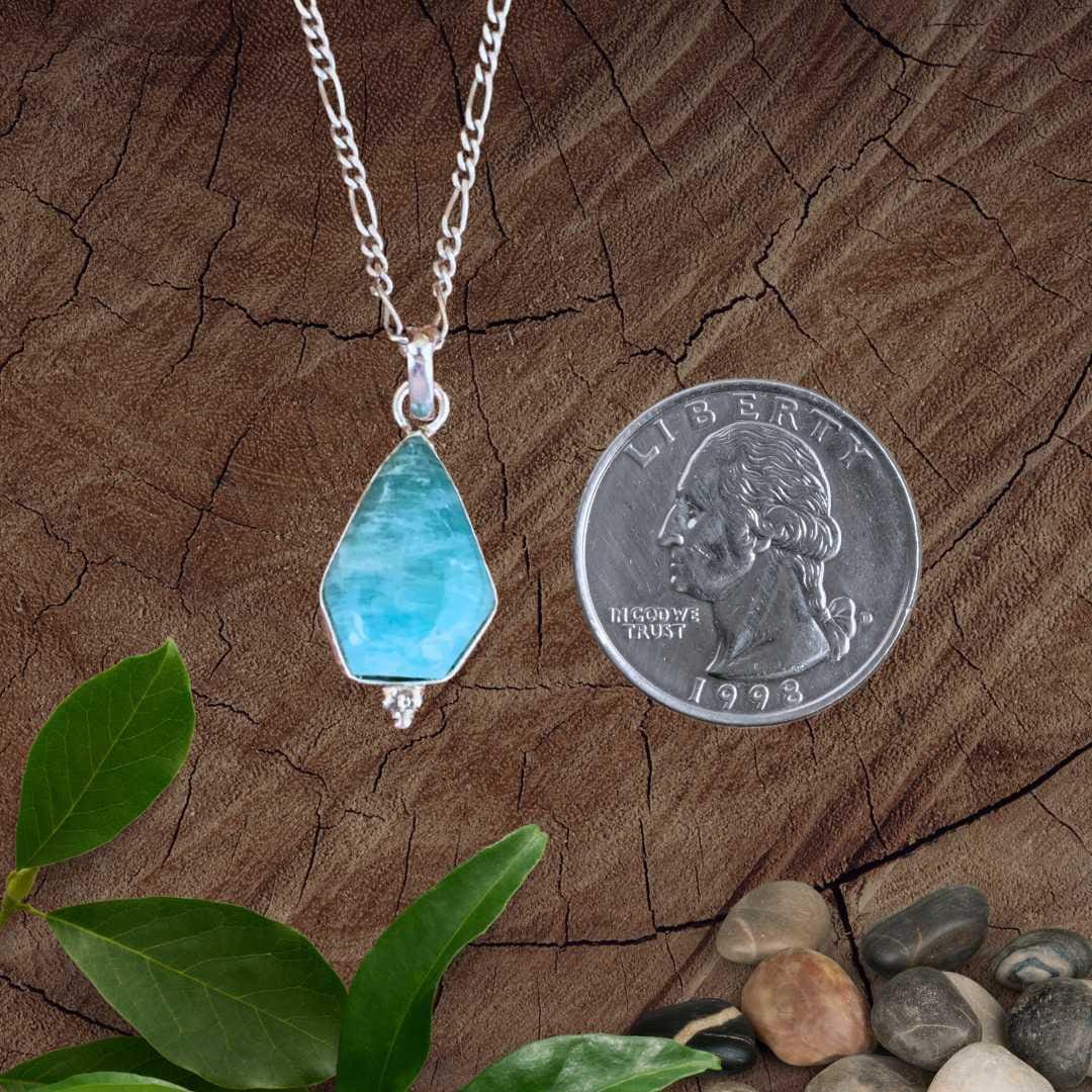 an image of a Geometric Amazonite and Sterling Silver Pendant next to a quarter