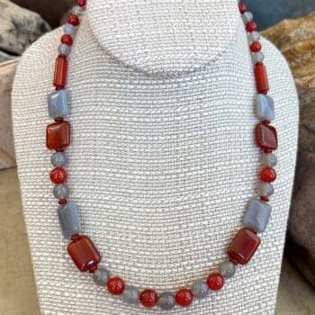an image of a Carnelian and Grey Agate Beaded Necklace with a mix of square, round and tube shaped beads.