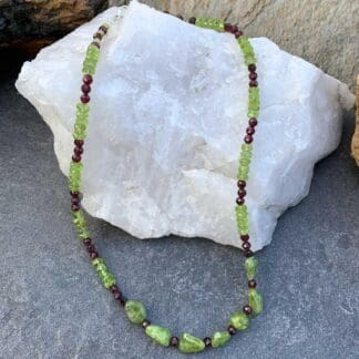 an image of a Faceted Garnet and Peridot Beaded Necklace with seven Peridot chips as accents