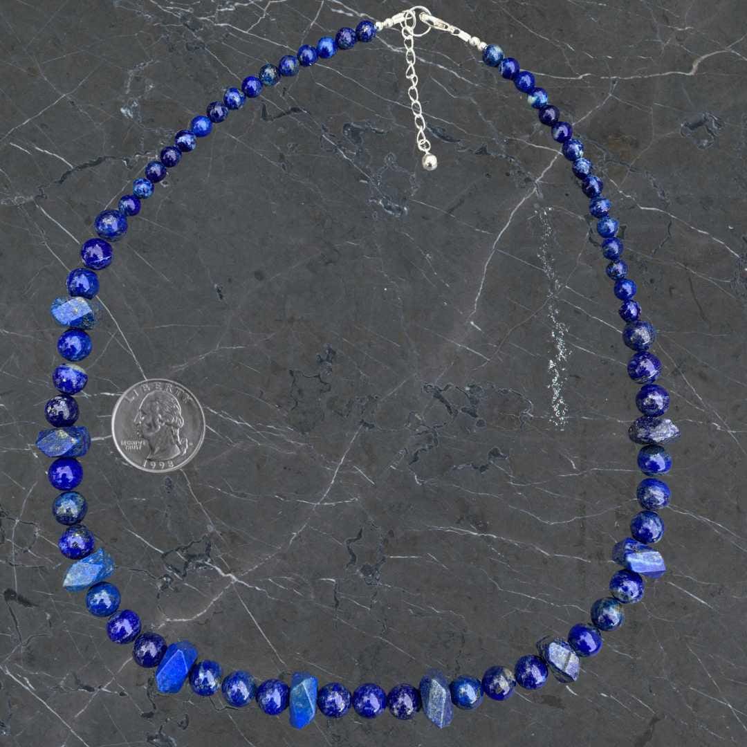 an image of a Beaded Lapis Lazuli and Sterling Silver Necklace next to a quarter