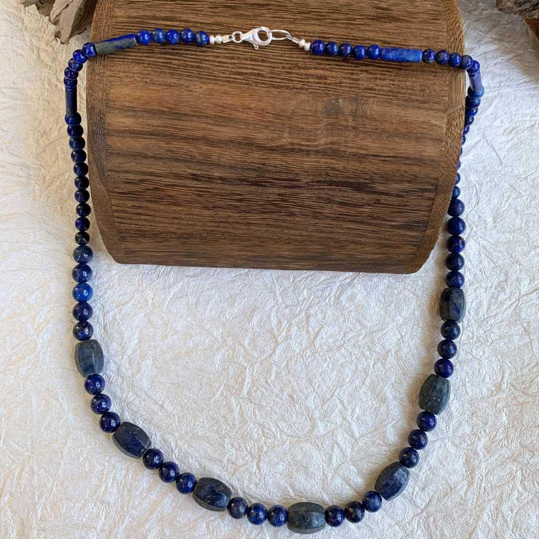 an image of a Lapis Lazuli Melon Barrel Mixed Bead Necklace that is 24.5 inches long and shows the sterling silver lobster clasp