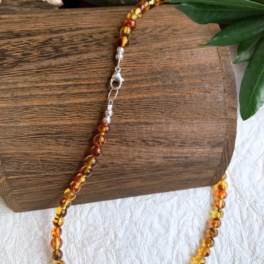 an image of a Simple Beaded Amber Necklace showing the sterling silver clasp