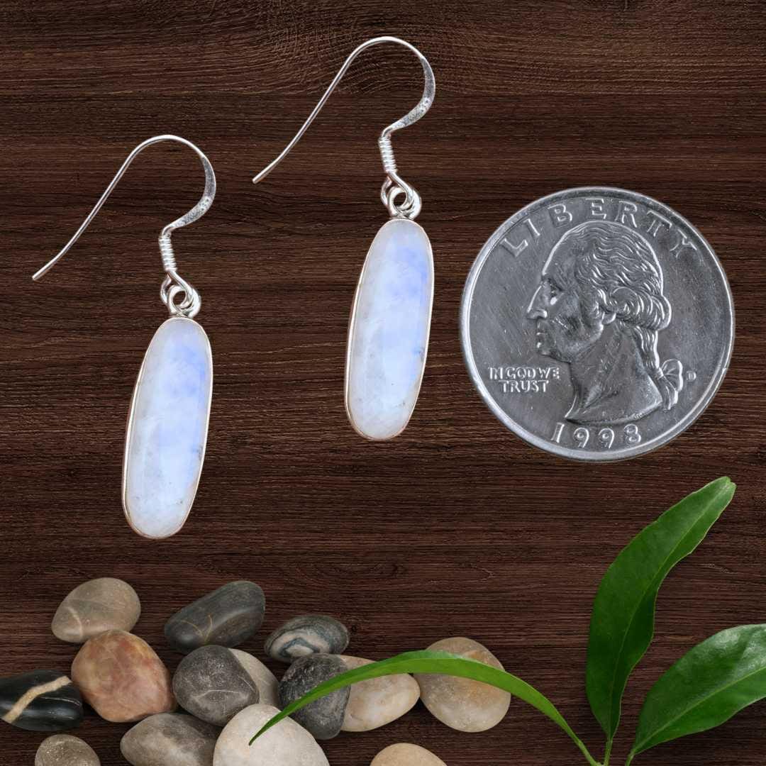 an image of a pair of Oblong Rainbow Moonstone and Sterling Silver Earrings with quarter