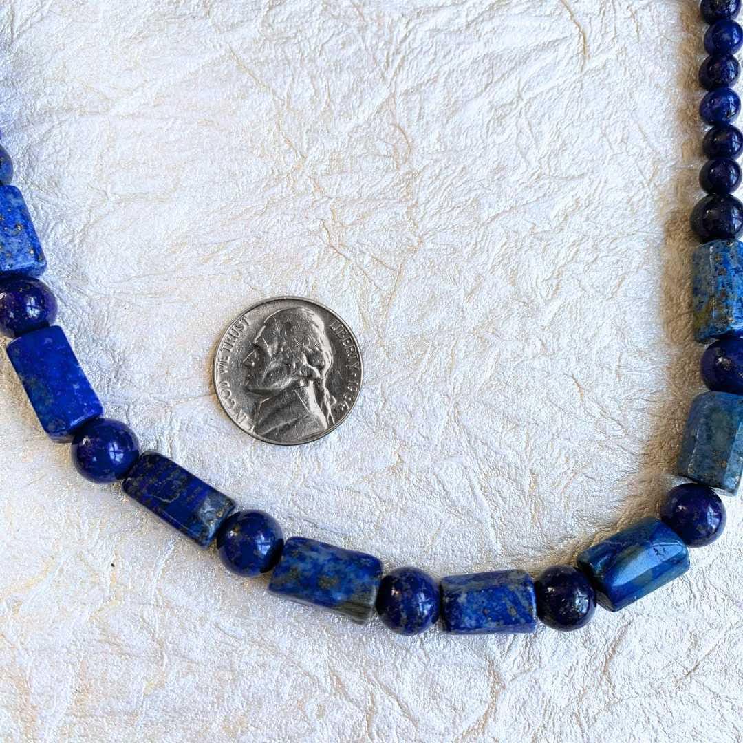 an image of a Natural Lapis Lazuli Tubes and Beads Necklace next to a nickel