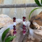 an image of a pair of Faceted Garnets and Pearl Earrings