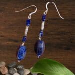 an image of a pair of Dangling Mixed Lapis and Silver Beaded Earrings that are 2.625 inches long and have a tube shaped bead with a high content silver spiral design made by Karen Hill Tribe in Thailand