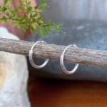an image of a pair of Tiny Plain Sterling Silver Hoop Earrings