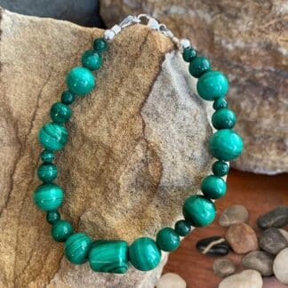 an image of a Assorted Round and Barrel Beaded Malachite Bracelet with sterling silver beads and lobster clasp on ends