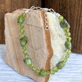 An image of a Beaded Peridot and Sterling Silver Bracelet with peridot nuggets and smooth round peridot beads