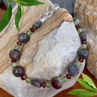 An image of a Dragon Blood Jasper with Peridot and Garnet Bracelet