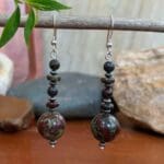 an image of a long dangling pair of Dragon Blood Jasper and Sterling Silver Earrings with sterling silver ear hook.