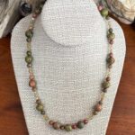 an image of a gemstone beaded necklace that is 19 inches long and has Unakite with Peach Moonstone and Peridot beads