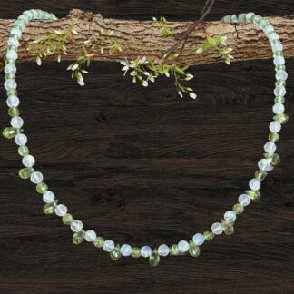 an image of a dainty Faceted Peridot and Rainbow Moonstone Necklace with 4mm faceted rainbow moonstone and peridot beads and eleven faceted small teardrop Peridot beads as focal pieces