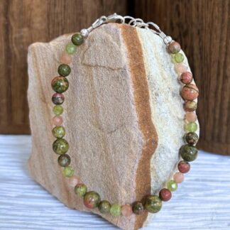 an image of a Unakite with Peach Moonstone and Peridot Bracelet finished with sterling silver beads and lobster clasp