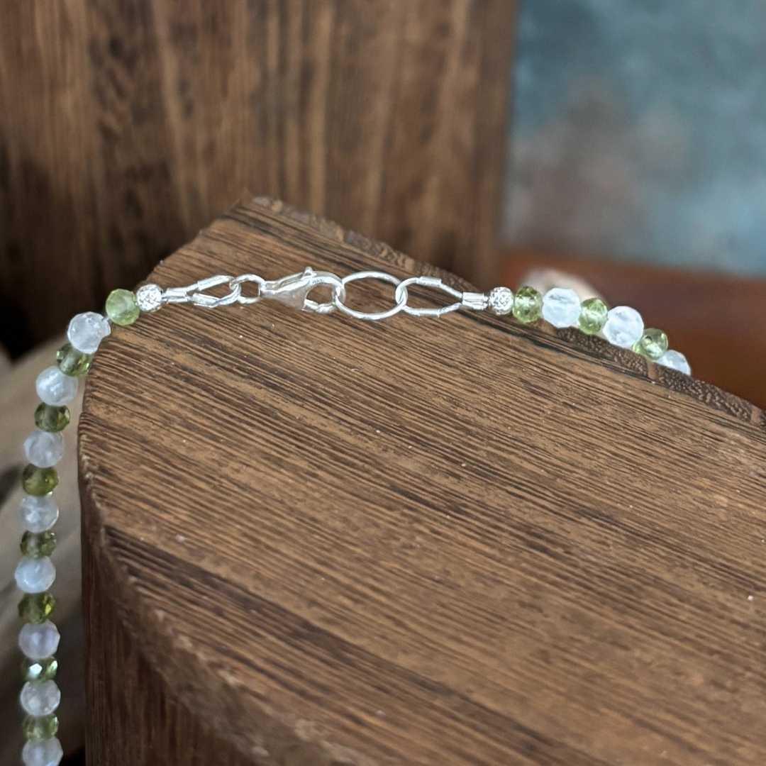 an image of our Faceted Peridot and Rainbow Moonstone Necklace showing the sterling silver lobster clasp