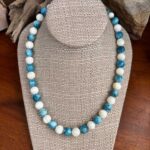 an image of a Round Apatite and Mother of Pearl Beaded Necklace with alternating apatite and mother of pearl beads that are each 10mm in size. It is finished off with sterling beads and lobster clasp