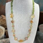 an image of a Citrine and Peridot Gemstone Necklace with assorted shapes of citrine beads and small round peridot beads and peridot small nuggets