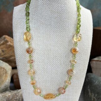 an image of a Citrine and Peridot Gemstone Necklace with assorted shapes of citrine beads and small round peridot beads and peridot small nuggets