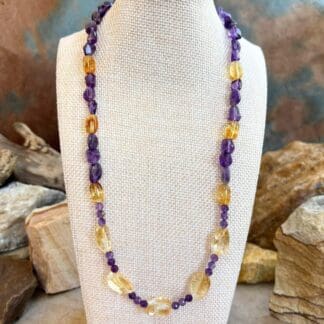 an image of a Citrine and Amethyst Beaded Necklace with citrine smooth nuggets, citrine barrel beads and 4 mm faceted amethyst and amethyst smooth nuggets. The necklace is 19.75 inches long