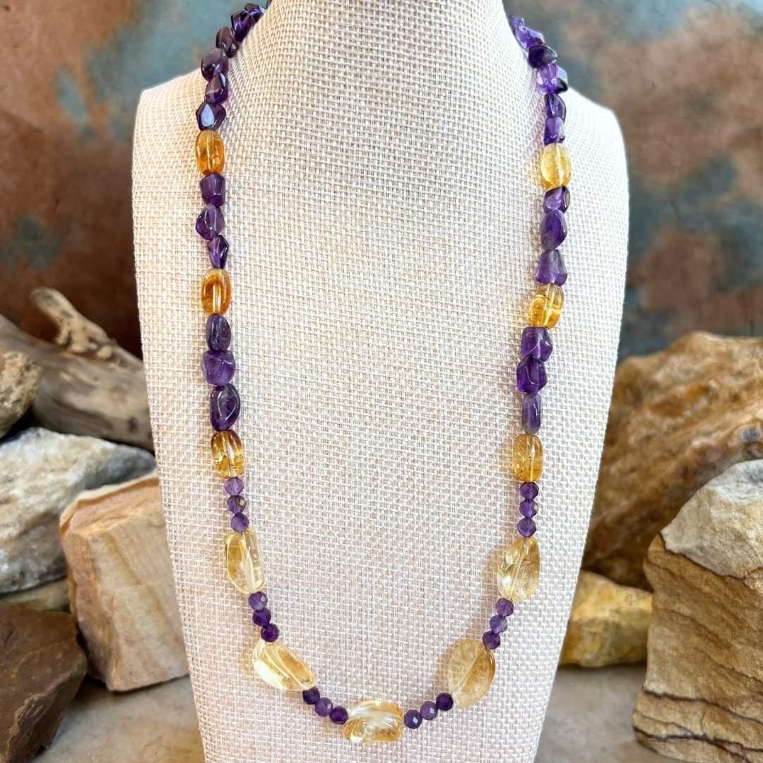 an image of a Citrine and Amethyst Beaded Necklace with citrine smooth nuggets, citrine barrel beads and 4 mm faceted amethyst and amethyst smooth nuggets. The necklace is 19.75 inches long