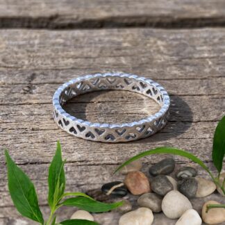 an image of a Sterling Silver Dainty Open Wraparound Hearts Ring with up and down open hearts that wrap all around the ring.