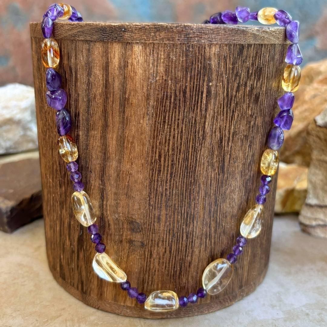 an image of a Citrine and Amethyst Beaded Necklace with citrine smooth nuggets, citrine barrel beads and 4 mm faceted amethyst and amethyst smooth nuggets. The necklace is 19.75 inches long