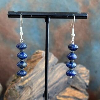 an image of a pair of Rondelle Lapis Lazuli and Sterling Silver Earrings with four rondelle beads separated by oxidized small sterling beads.