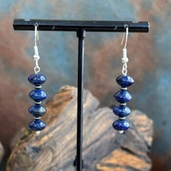 an image of a pair of Rondelle Lapis Lazuli and Sterling Silver Earrings with four rondelle beads separated by oxidized small sterling beads.