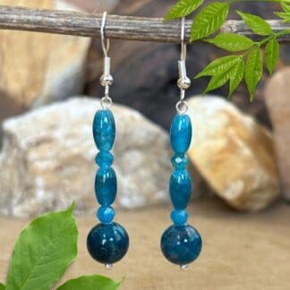 an image of a pair of Mixed Apatite and Sterling Silver Earrings with a mix of round and barrel beads on sterling hooks.