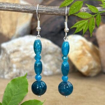 an image of a pair of Mixed Apatite and Sterling Silver Earrings with a mix of round and barrel beads on sterling hooks.