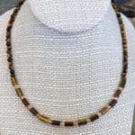 an image of a Tiger's Eye and Citrine Choker Necklace consisting of tiger's eye small tube beads separated by 4mm faceted citrine beads and finished with 4mm round tiger's eye beads going up the neck to the back