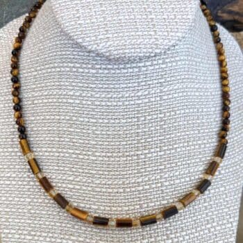 an image of a Tiger's Eye and Citrine Choker Necklace consisting of tiger's eye small tube beads separated by 4mm faceted citrine beads and finished with 4mm round tiger's eye beads going up the neck to the back