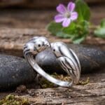 an image of a Sterling Silver Lovebirds Ring showing two birds leaning in for a kiss