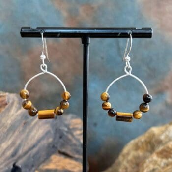 an image of a pair of Beaded Tiger's Eye and Sterling Silver Hoop Earrings hanging from a sterling silver ear hook
