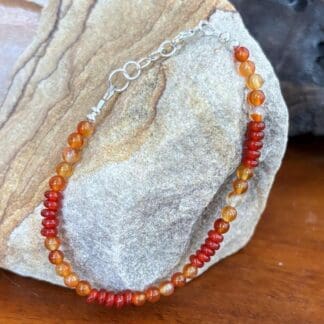 an image of a Dainty Carnelian Beaded Bracelet with 4 mm round and rondelle carnelian beads and sterling silver lobster clasp